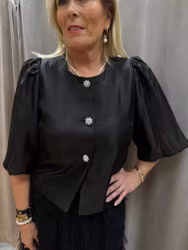 Svart festjacka med puffärm och knappar