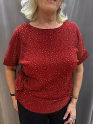 Röd glittrig topp med knytdetalj