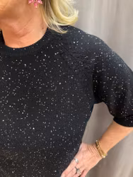 Svart stickad tröja med små paljetter