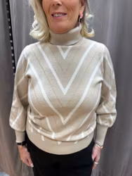 Beige stickad tröja med guldigt och vitt mönster