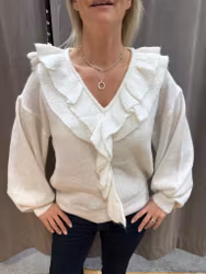 Creme vit stickad tröja med volang