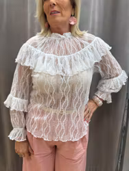 Transparent vit spetsblus med volanger