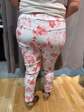 Vita magiska byxor med ljusröda blommor