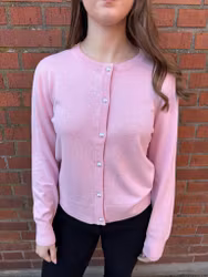 Rosa kofta med pärlknappar