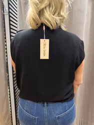 Svart volanglinne med knyt