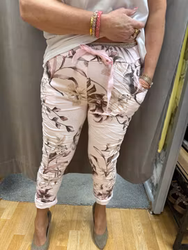 Rosa magiska byxor med beige blommor