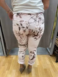 Rosa magiska byxor med beige blommor