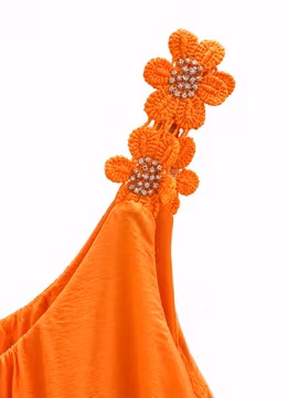 Orange linne med broderade blommor