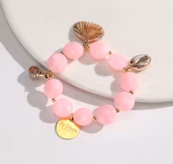 Rosa armband med snäckskal