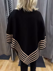 Svart poncho med beige mönster