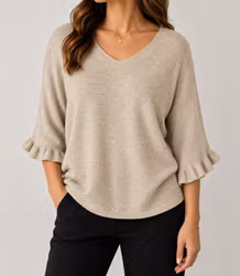 Beige stickad tröja med volangärm