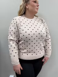 Beige stickad tröja med svarta prickar