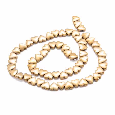 Syntetiska hematite hjärtan guldfärgade på sträng 8mm