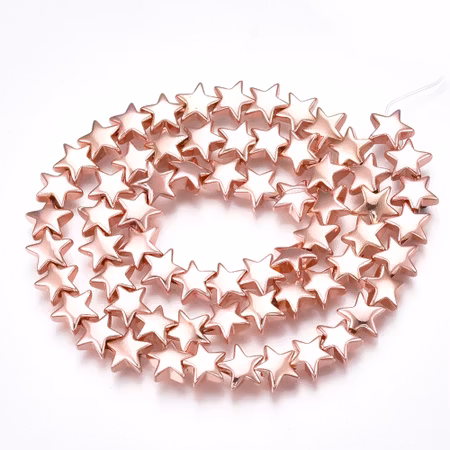 Syntetiska hematite stjärnor rosegold på sträng 8mm