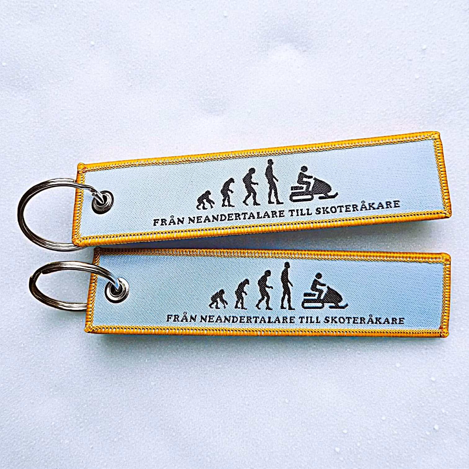 Från Neandertalare till skoteråkare - Nyckelring/tag