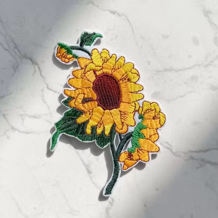 Solros – Broderat Blommärke