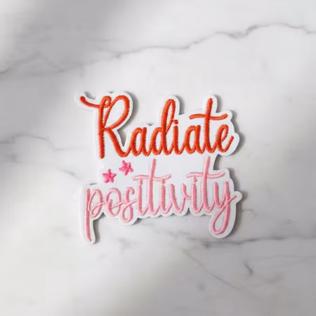 Radiate positivity tygmärke