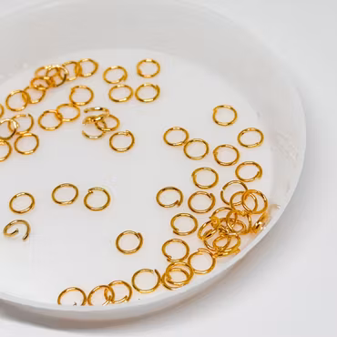 Bindringar 4mm Guld ca 80st