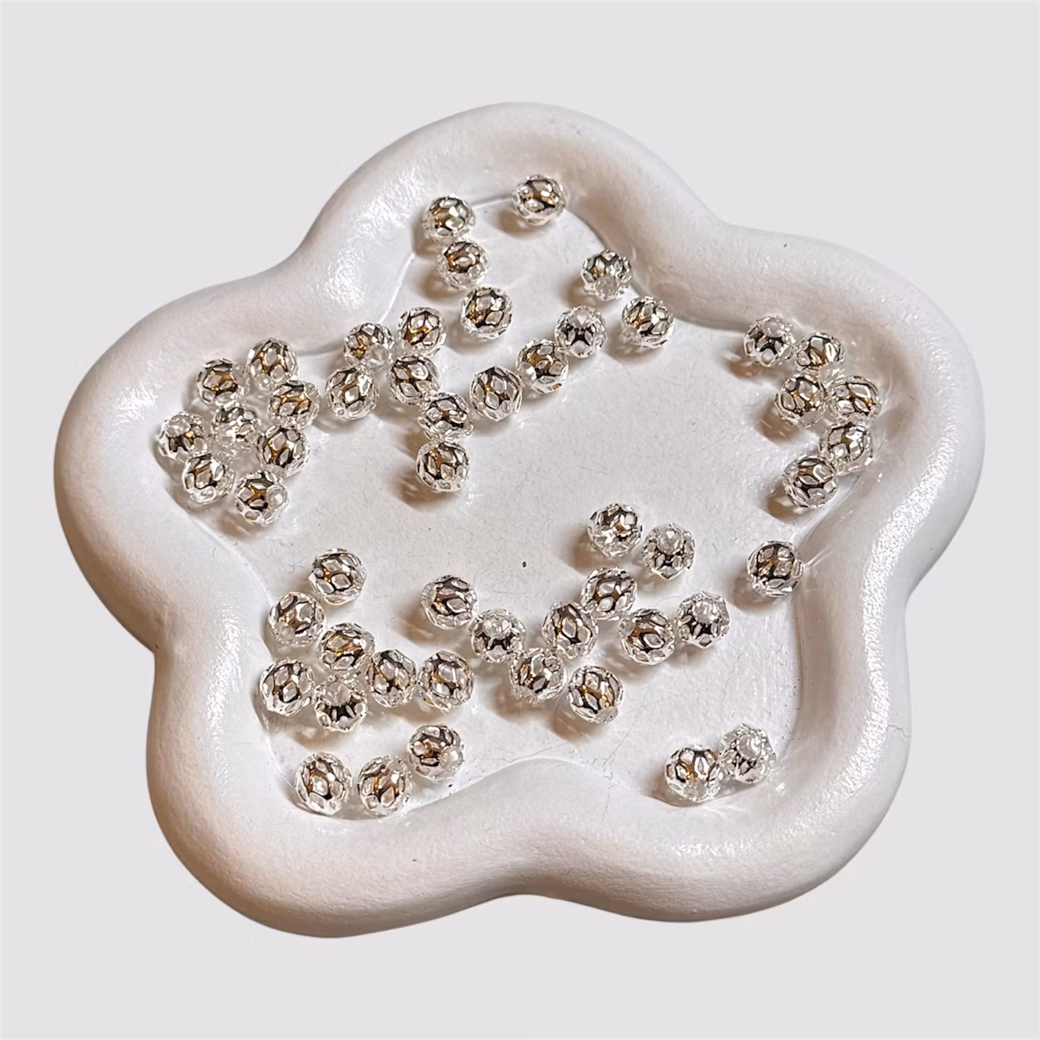 6mm mellandel "cage" silver 50st