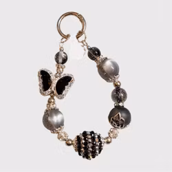 Väsksmycke svart fjäril 1st