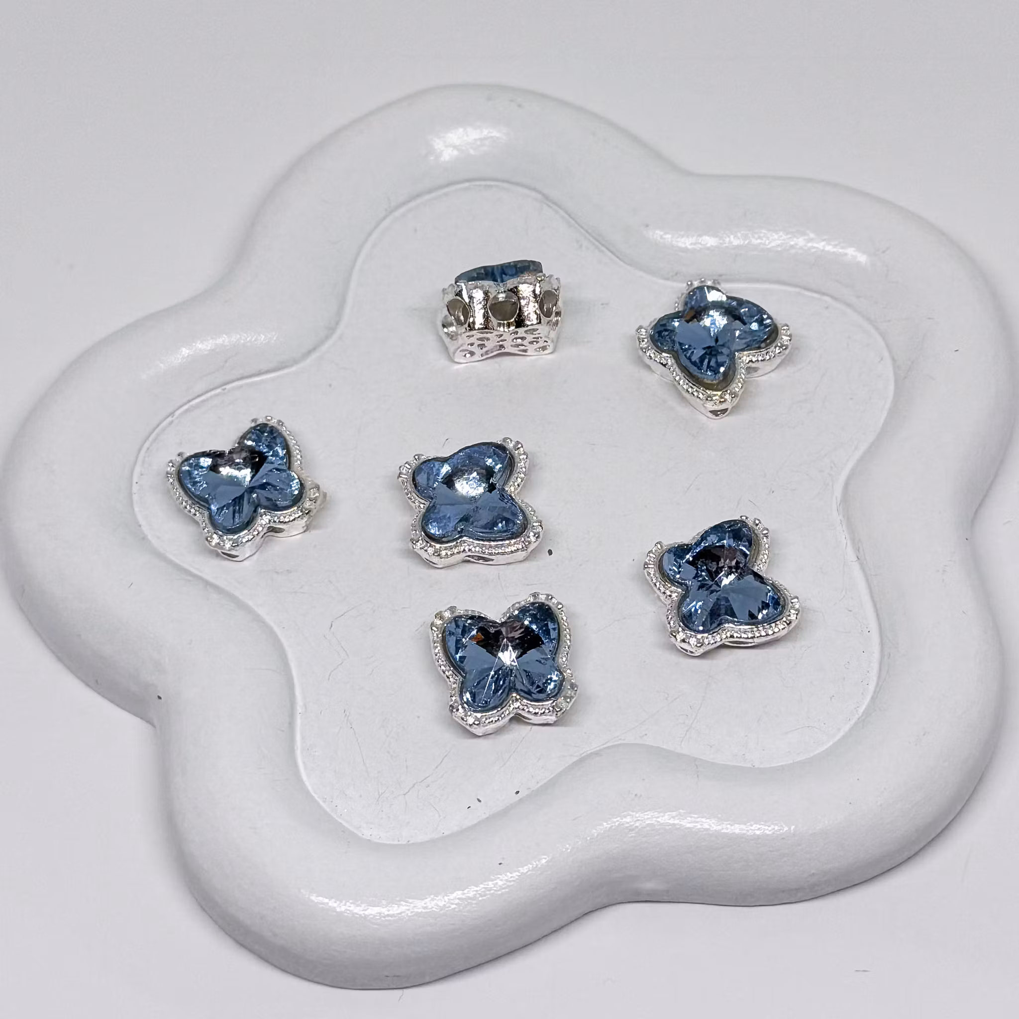 Fjäril multihål "8 hål" Gråblå 1st