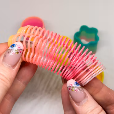 Mini slinky Random färg/form 1st