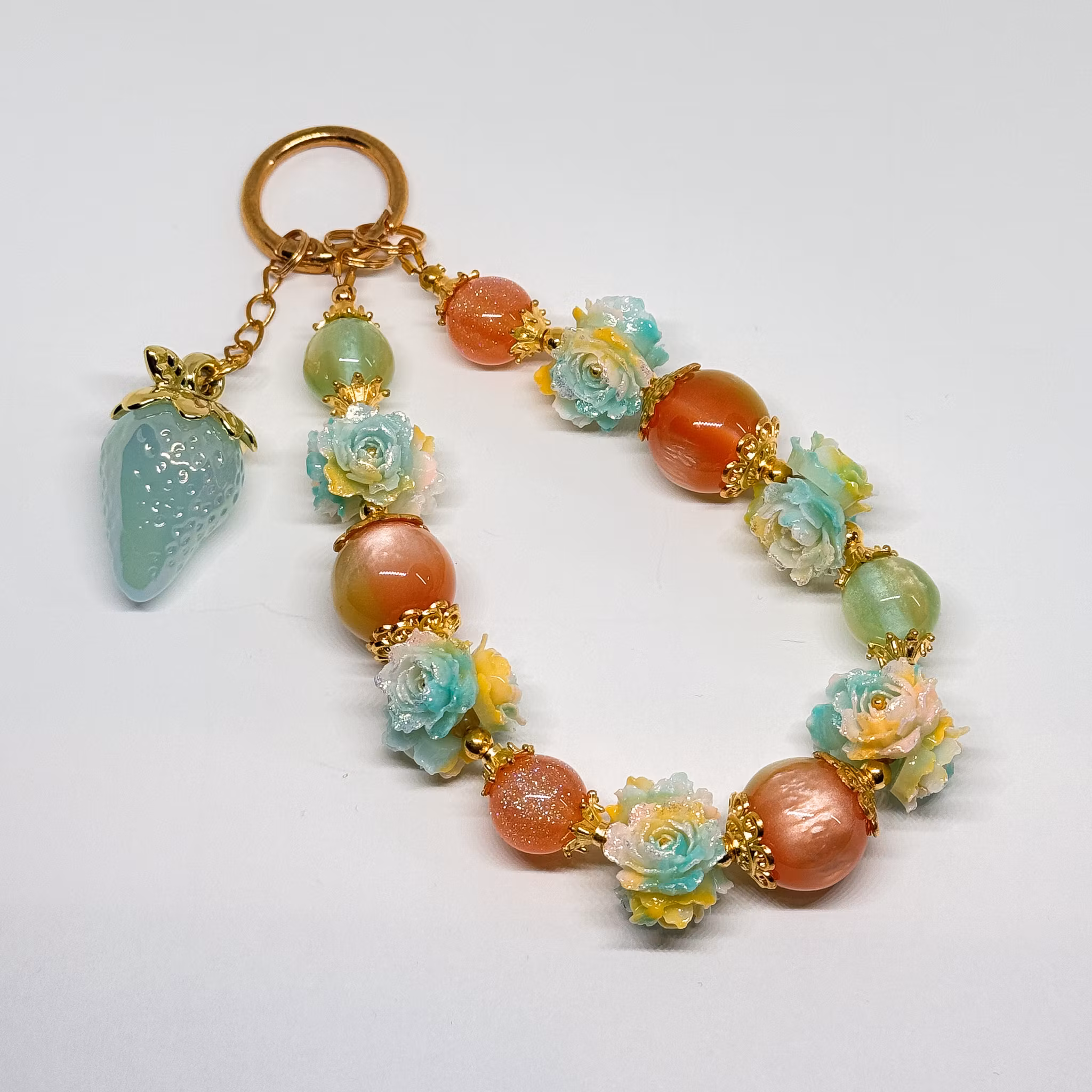 Väsksmycke orange teal 1st