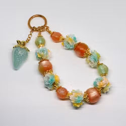 Väsksmycke orange teal 1st