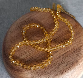 Glaspärlor facetterade - ljus bärnsten 4 mm