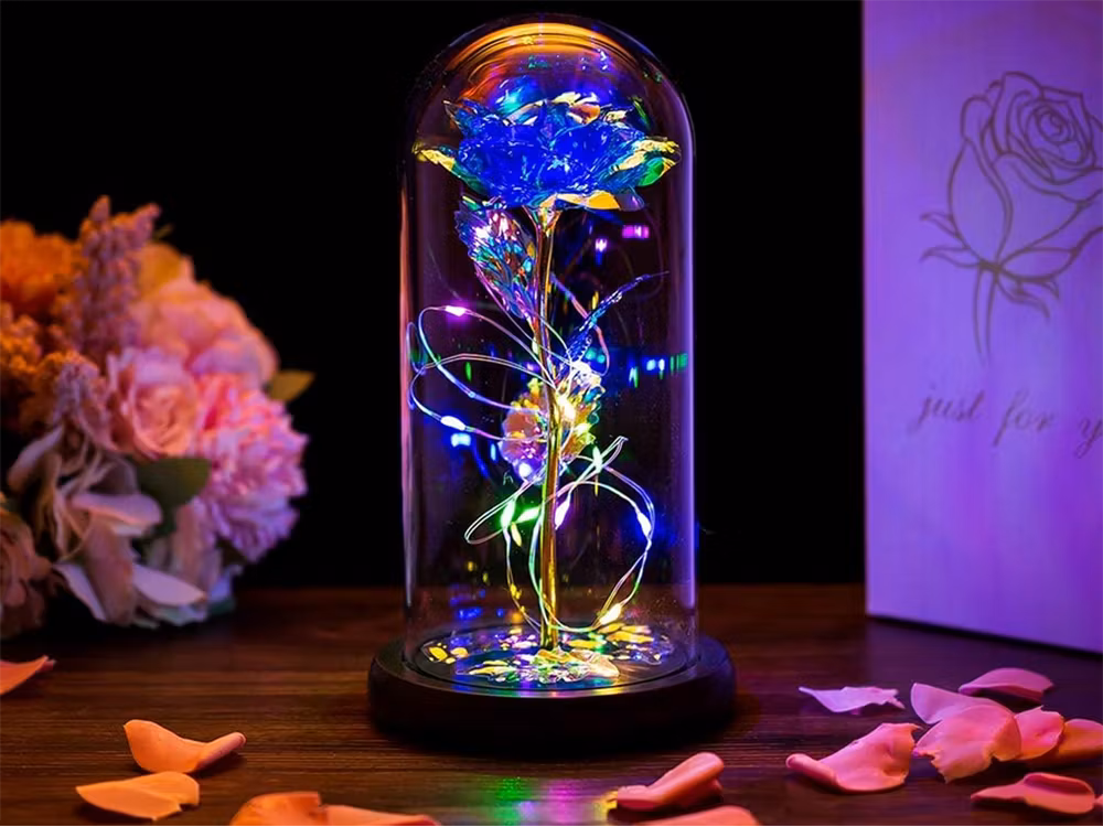 Evig ros i glasgåva som lyser blått- present