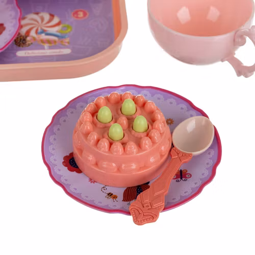 Teservis för flickor i resväska med kakor och koppar