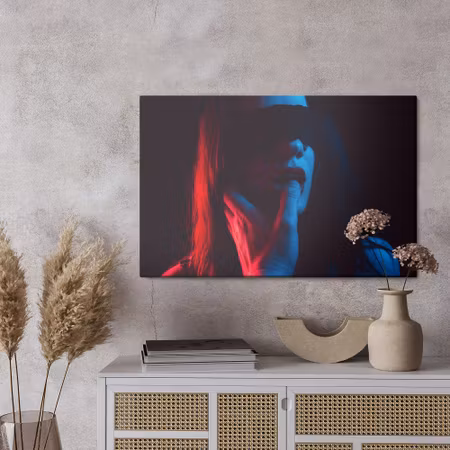 Canvastavla - A woman in the light of colored lamps