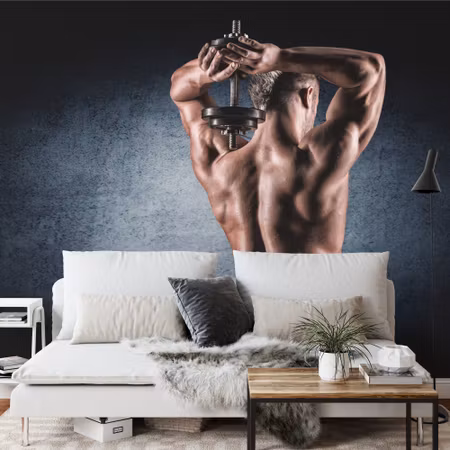 Fototapet - Muscular man with dumbbell