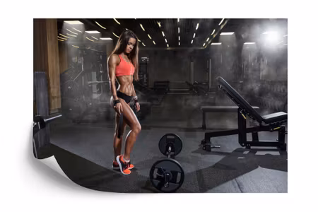 Fototapet - Athletic woman at the gym