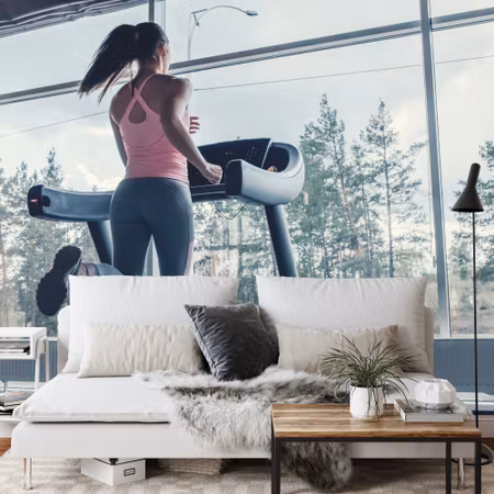 Fototapet - Woman on a treadmill with the