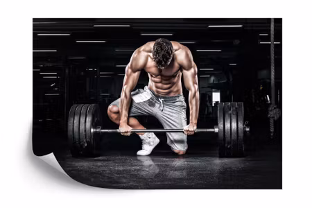Fototapet - Bodybuilder with a barbell