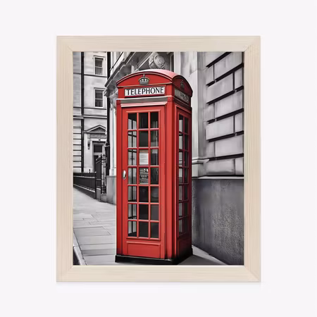 Poster med ram - A red telephone booth on a black