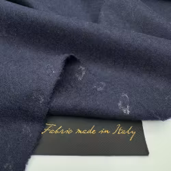 1,5m Ull singeljersey marin med litet hål