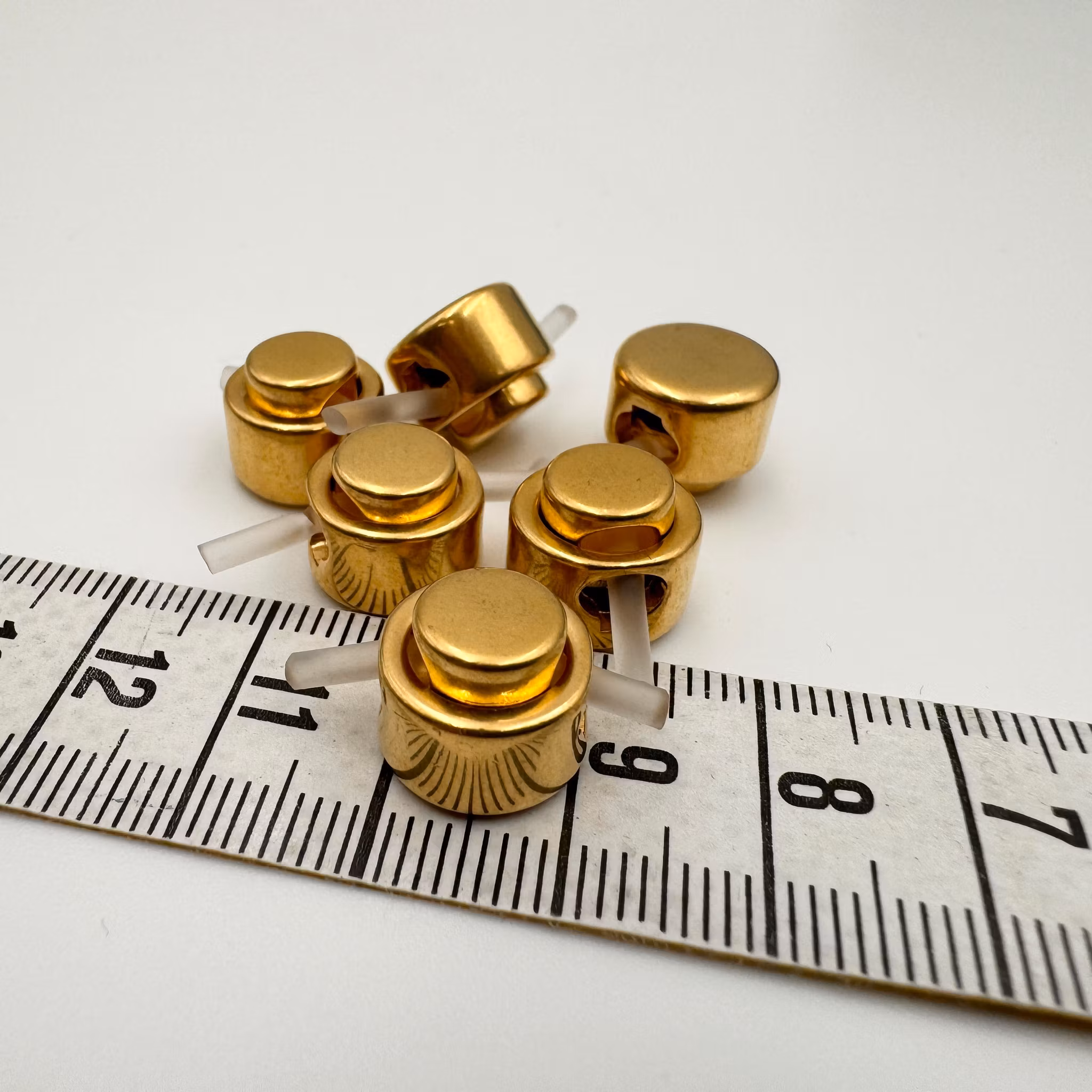 Snörstopp guld Escad*