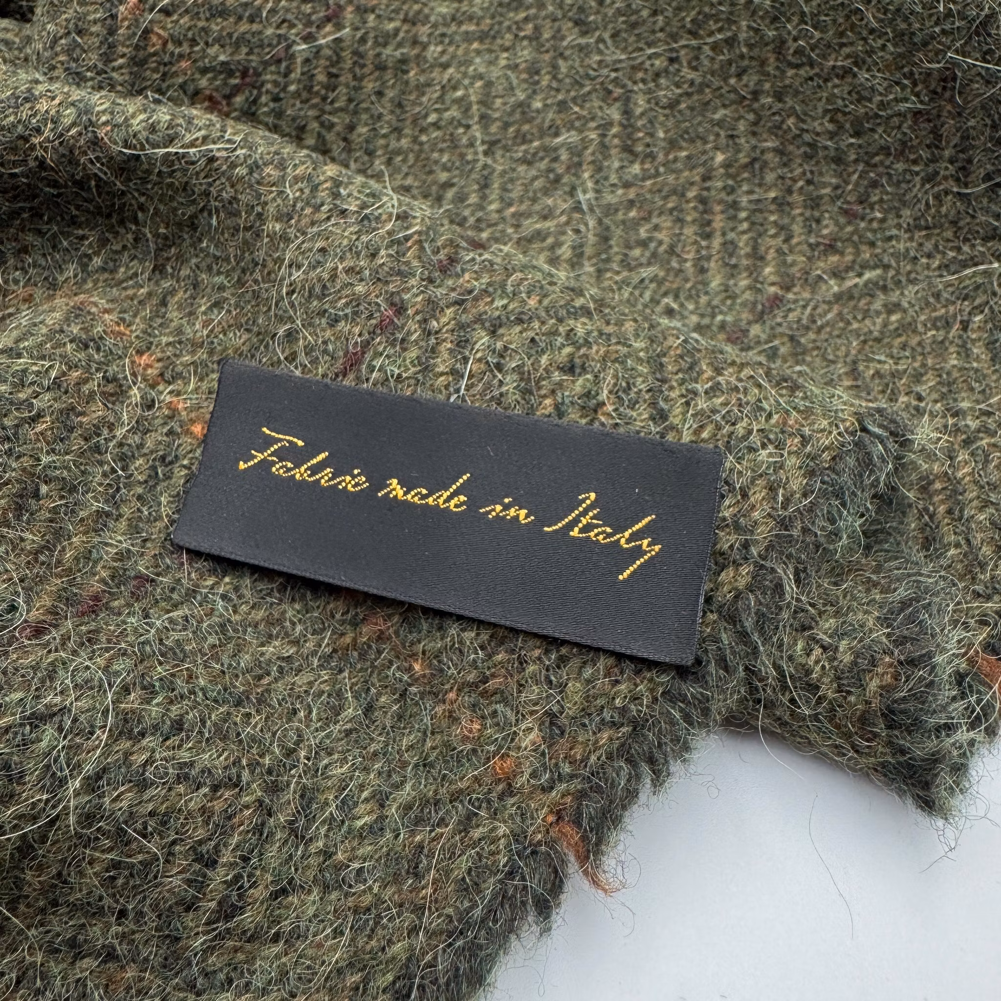 Fluffig tweed mörkgrön gåsöga Hermè*