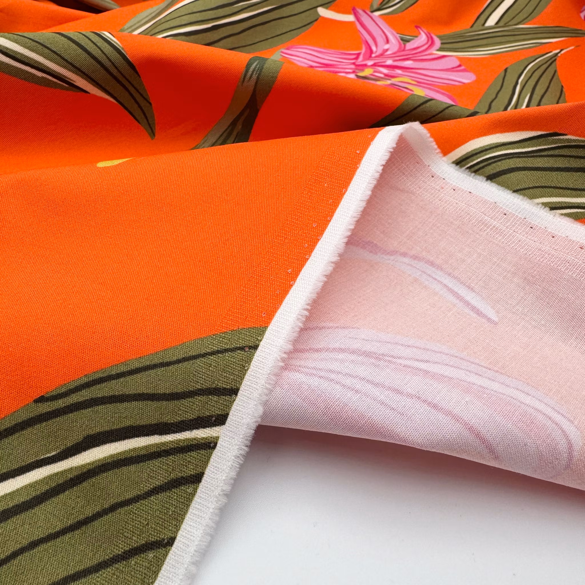 Bomull/elastan orange storblommig Hugo B***