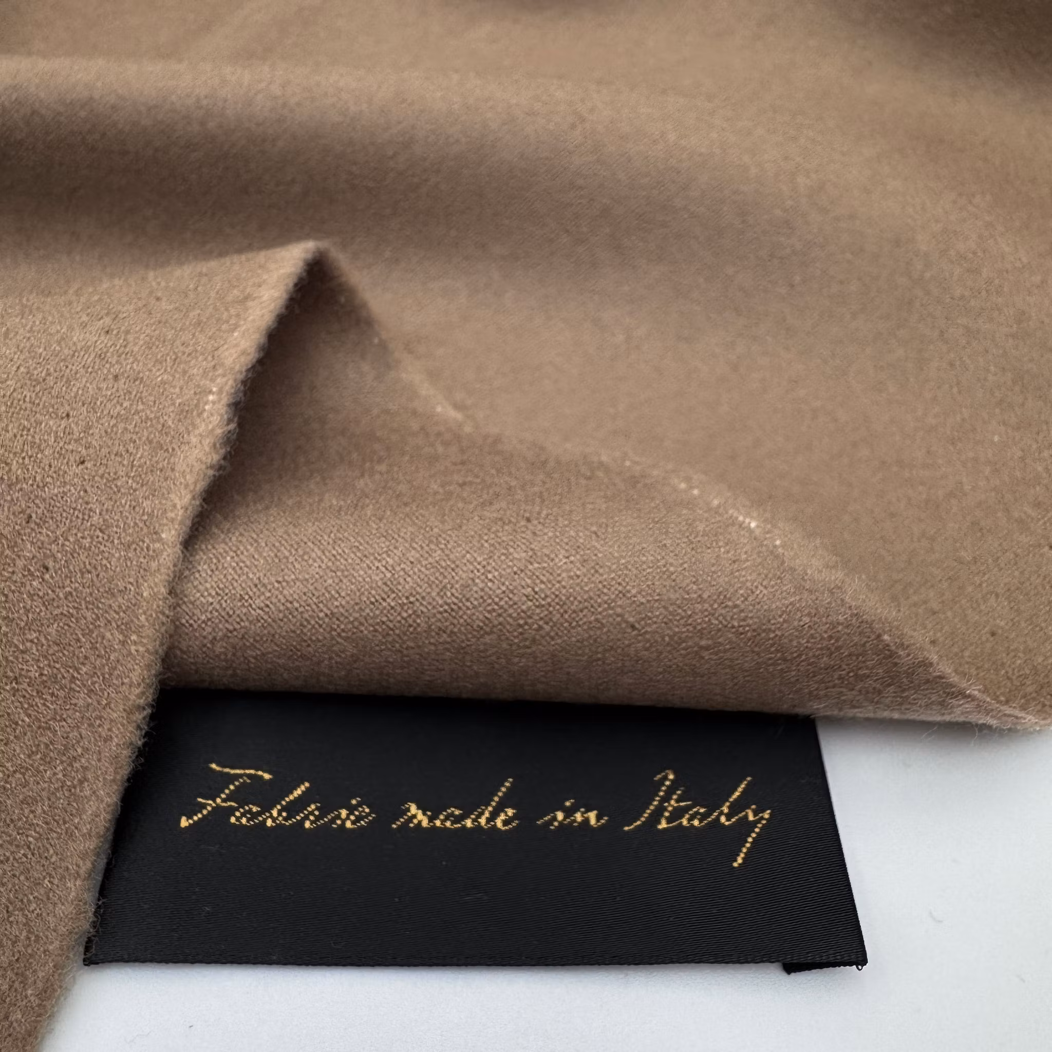 Ull/elastan borstad ljusbrun Riccer*