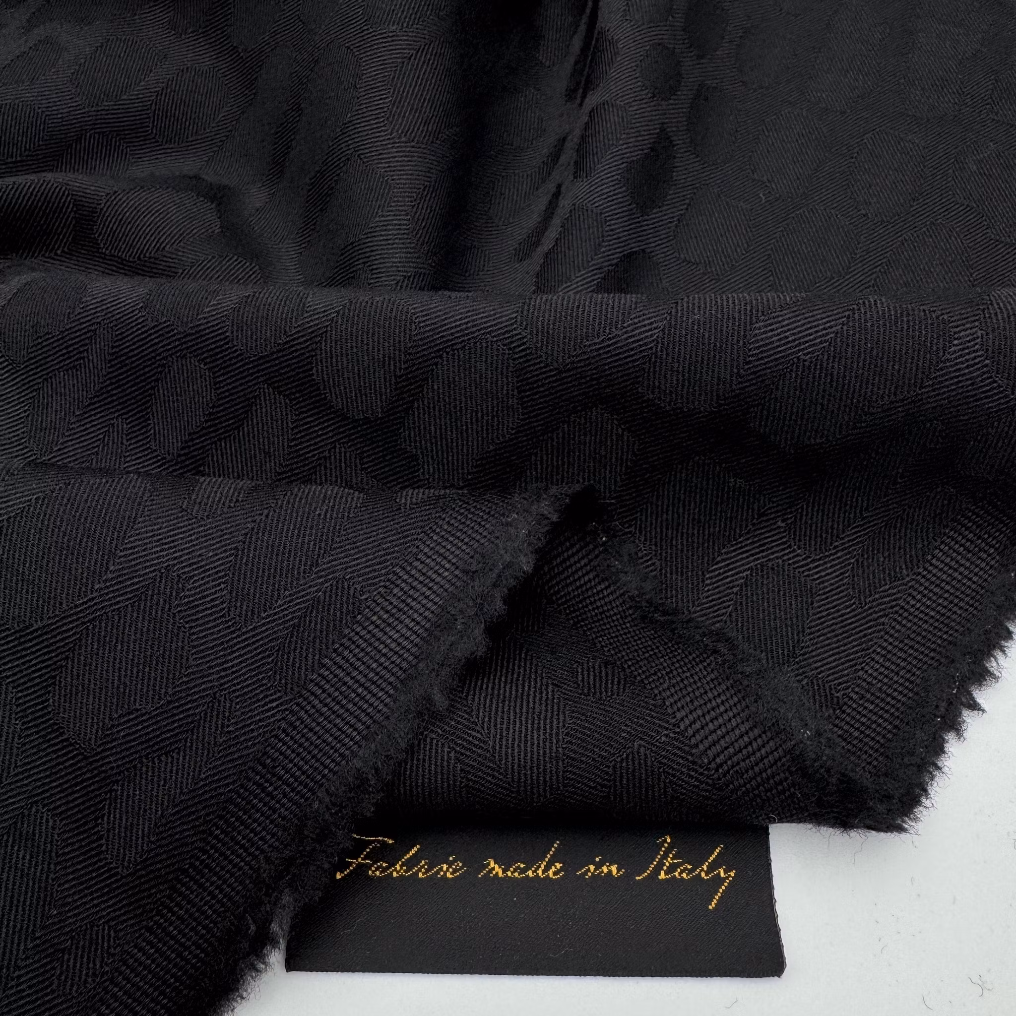 Ull/elastan jaquard svart