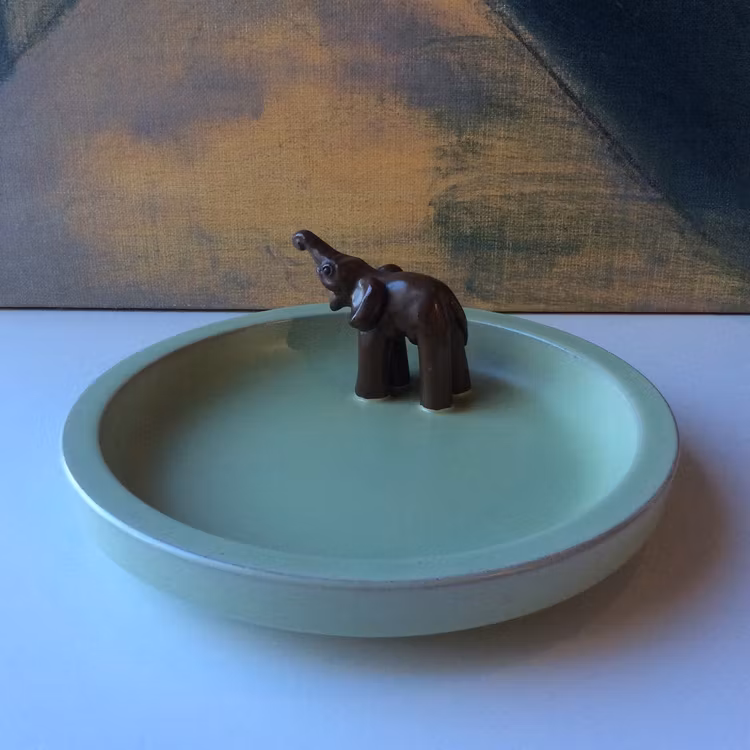 Green bowl with brown elephant