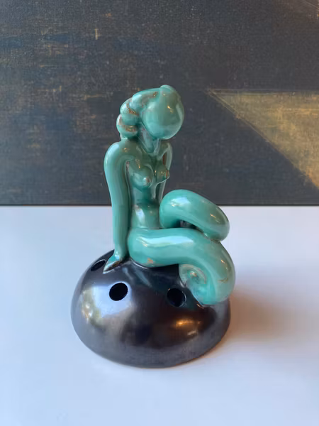 Green lady on black flower holder 30