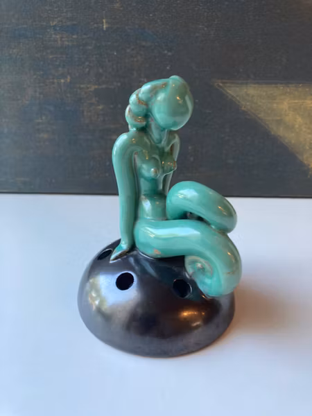 Green lady on black flower holder 30