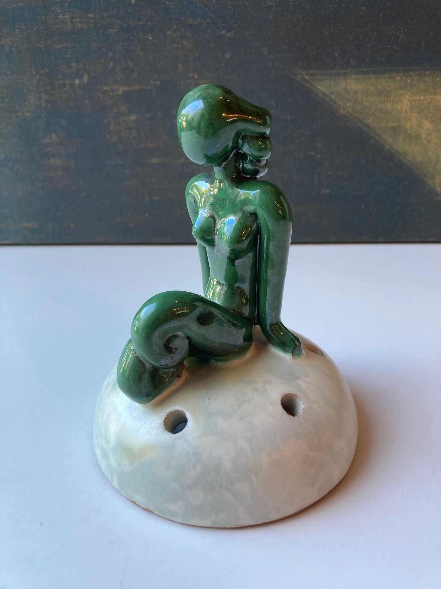 Green lady on greyish flower holder 30