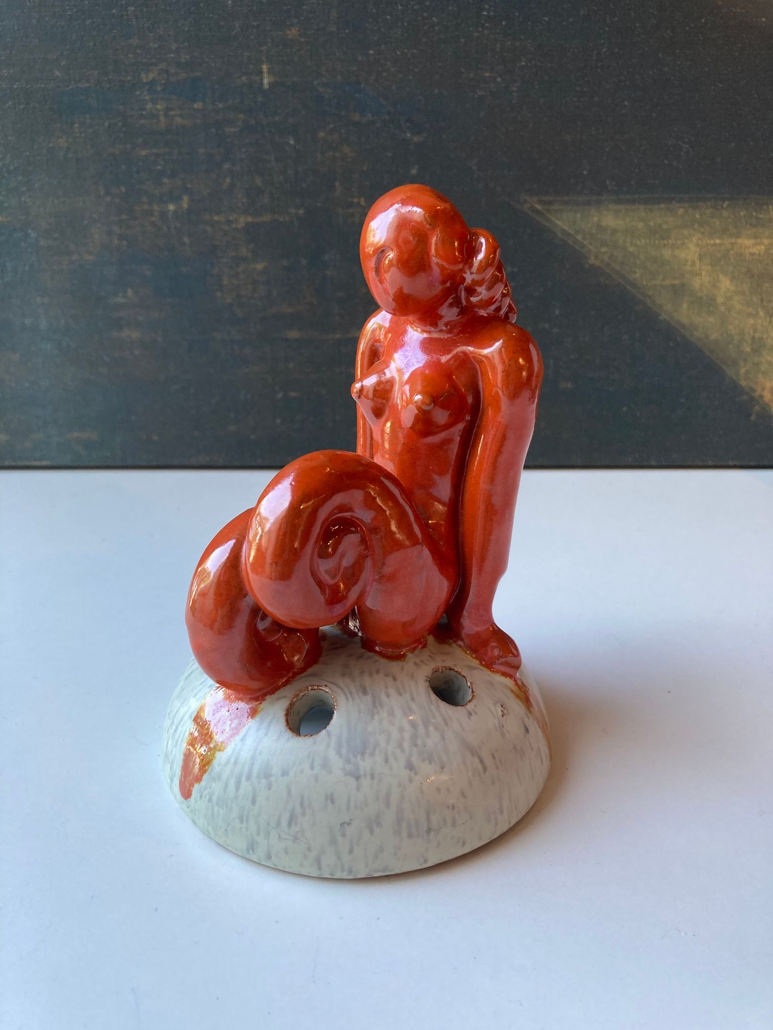 Orange lady on greyish flower holder 30