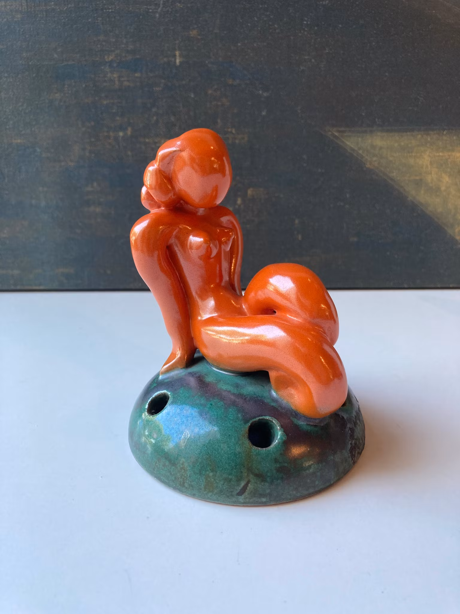 Orange lady on green flower holder 30