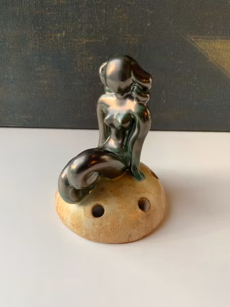 Green lady on yellowish flower holder 30